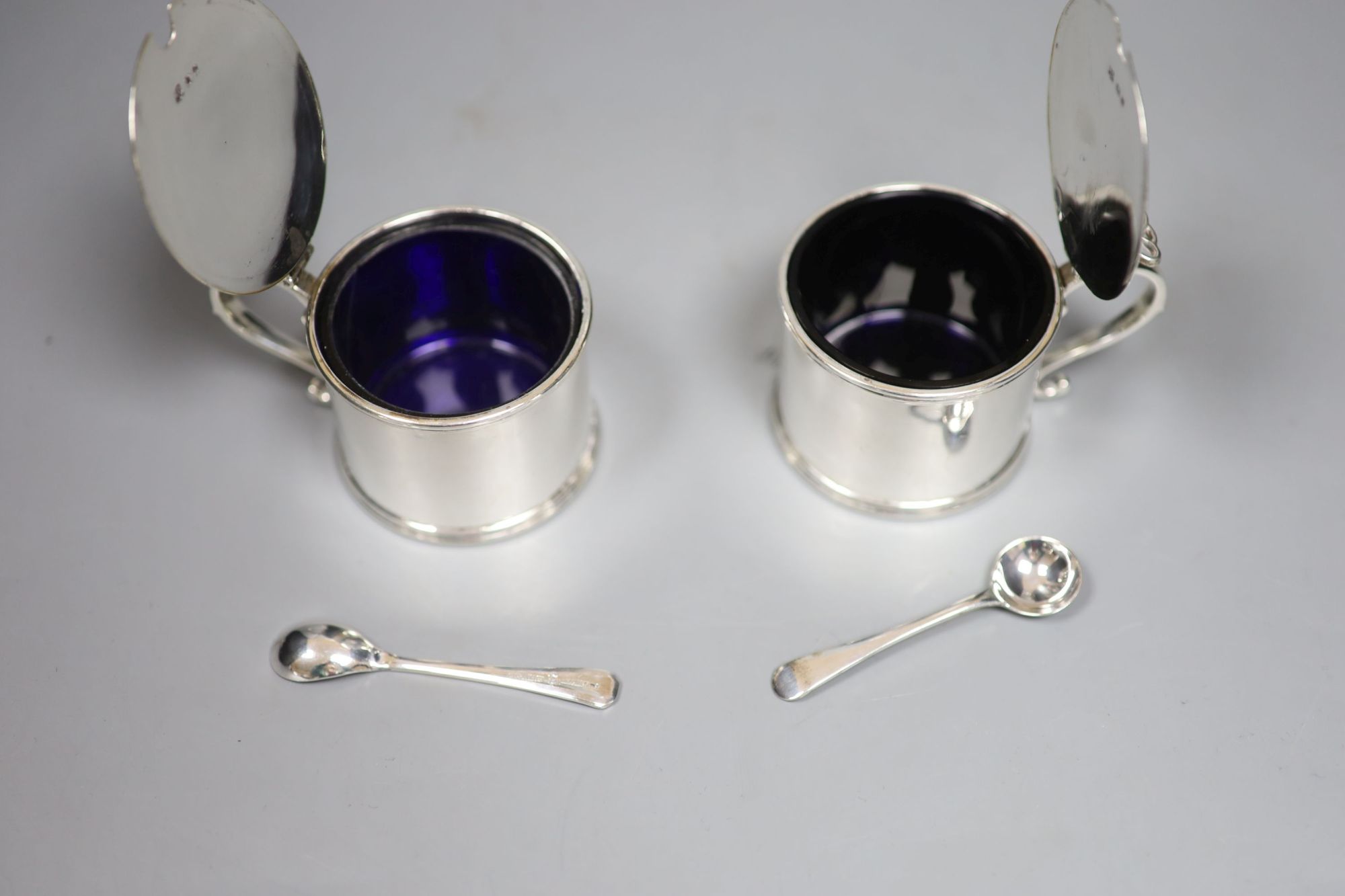 A pair of George V silver drum mustard pots, William Comyns & Sons Ltd, London, 1935, 66mm, 7.5oz,